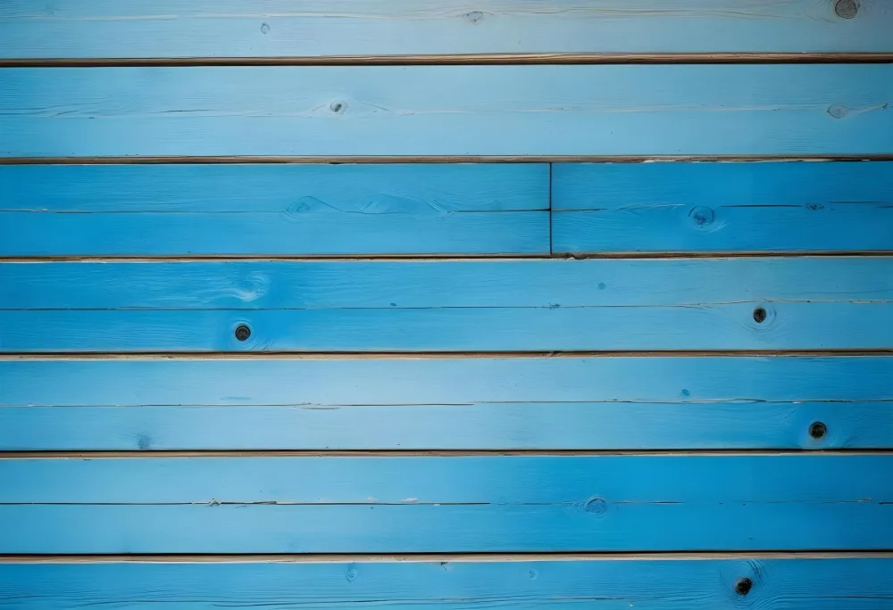 Blue Painted Wooden Planks With Visible Wood Grain And Knots Arranged Horizontally Creating A Rustic And Textured Surface 13 Bda0