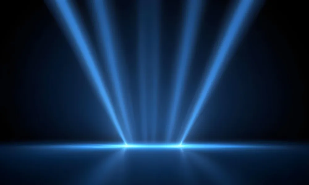 Blue Rays Of Light Emanating From The Ground The Light Is Bright And Intense The Background Is Dark And Blurry Creating A Sense Of Depth 25 0f13
