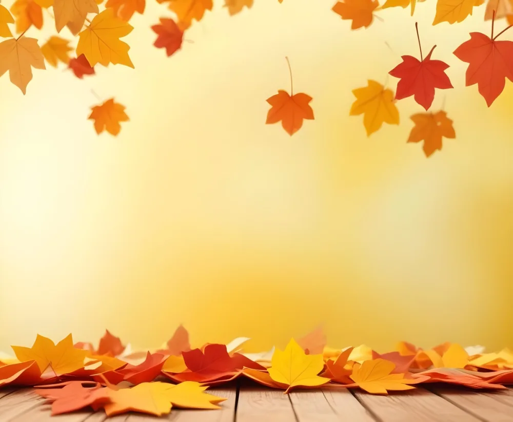 Colorful Autumn Leaves Falling On A Blurred Yellow And Orange Background With A Wooden Surface In The Foreground 11 Ce4f