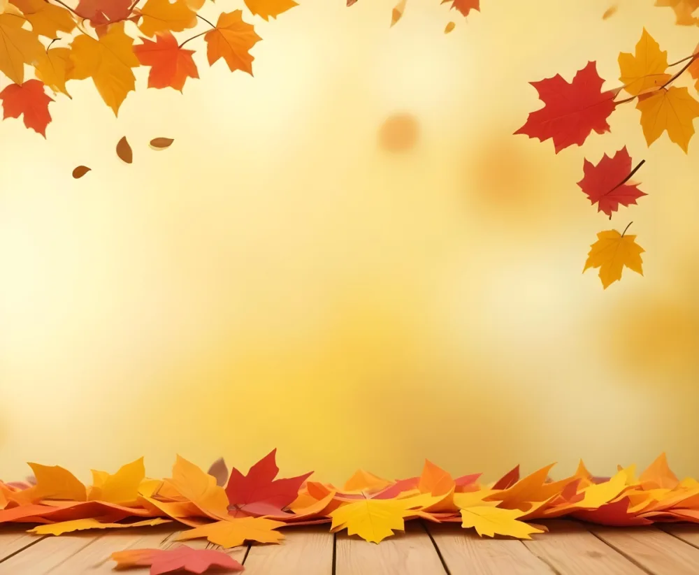 Colorful Autumn Leaves Falling On A Blurred Yellow And Orange Background With A Wooden Surface In The Foreground 15 7532