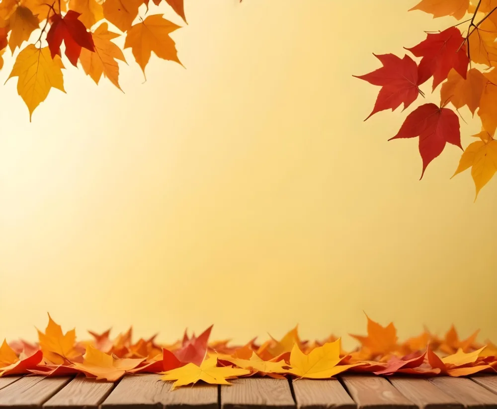 Colorful Autumn Leaves Falling On A Blurred Yellow And Orange Background With A Wooden Surface In The Foreground 19 D158