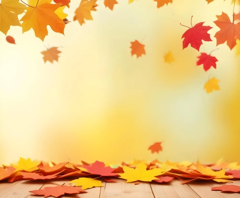 Colorful Autumn Leaves Falling On A Blurred Yellow And Orange Background With A Wooden Surface In The Foreground 4 E7d8