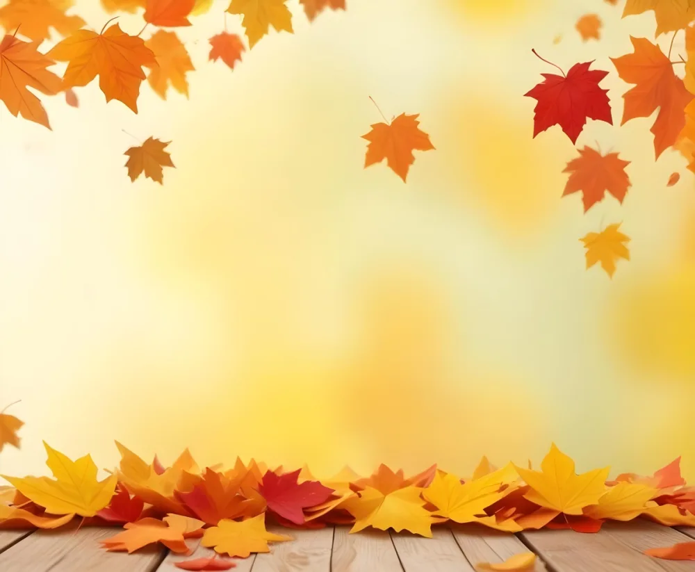 Colorful Autumn Leaves Falling On A Blurred Yellow And Orange Background With A Wooden Surface In The Foreground 7 523c