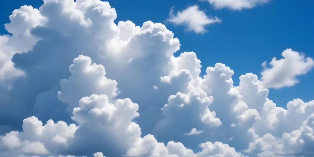 Fluffy White Clouds In A Bright Blue Sky 12 A411