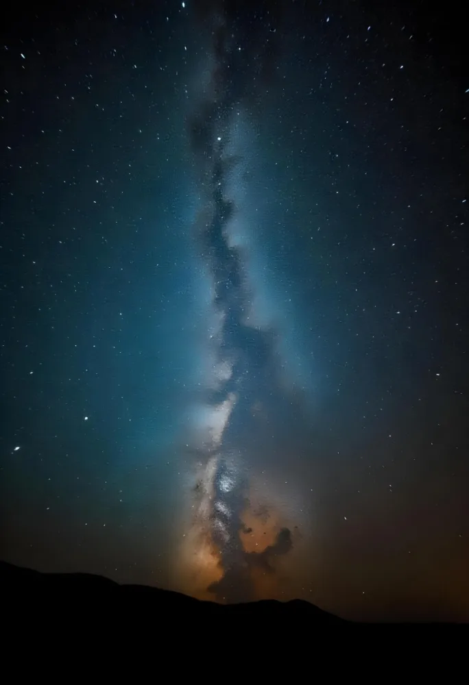Milky Way Galaxy With A Vibrant Display Of Stars Cosmic Dust And Celestial Colors Against A Dark Night Sky With A Faint Glow On The Horizon 35 660a