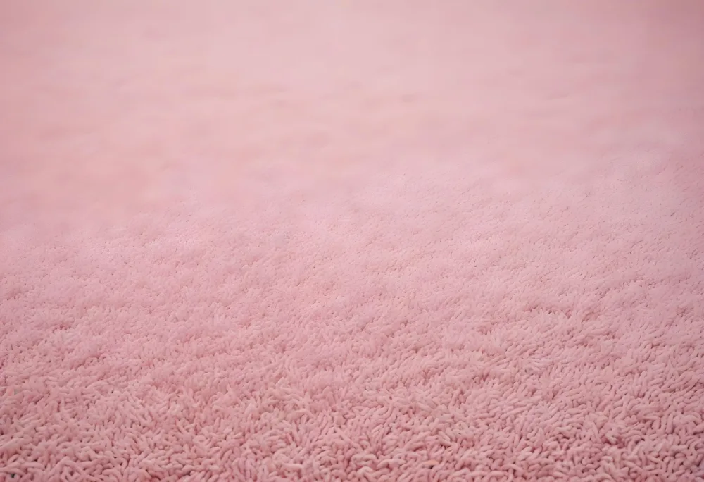 Minimal Soft Studio Light Photography A Close Up View Of A Soft Textured Pink Carpet Or Rug With A Subtle Pattern High Detail Solid Bold Color Background 20 1979
