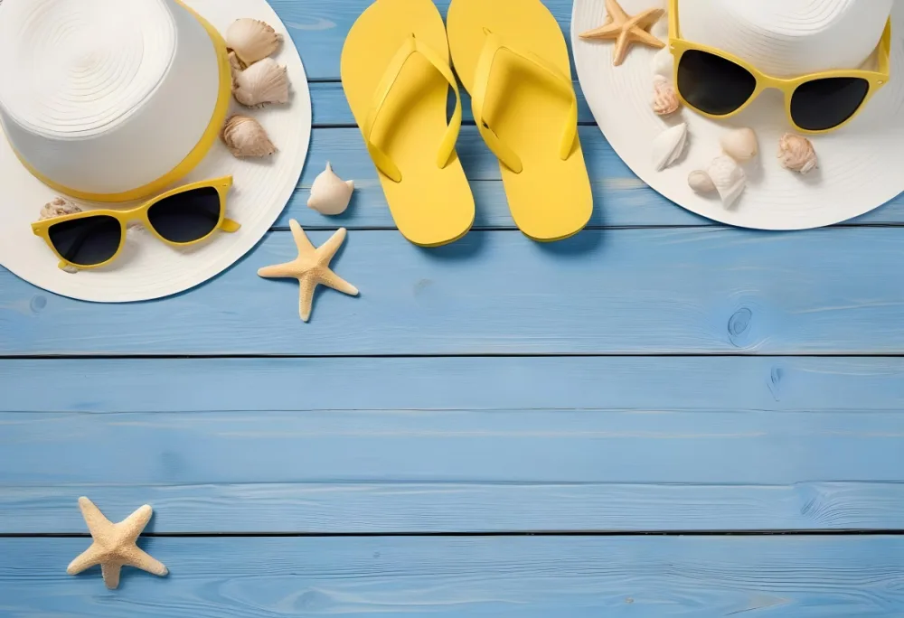 Overhead Shot Of A White Hat Yellow Flip Flops Sunglasses Seashells And Starfish On A Blue Wooden Surface 10 8aac