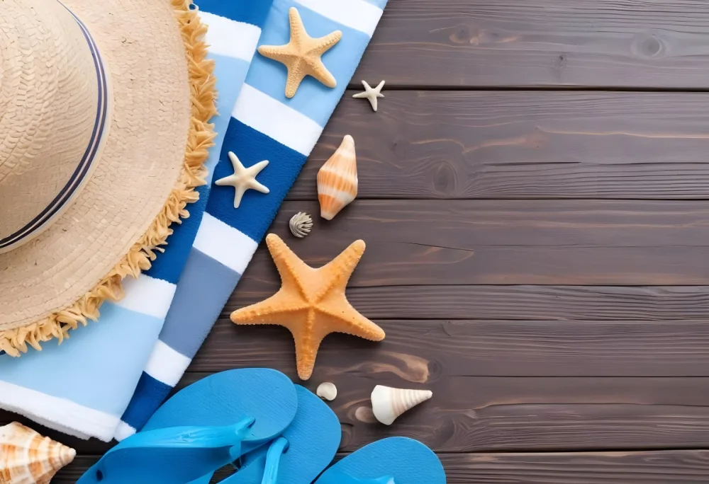 Straw Hat Blue Striped Towel Starfish Seashells And Blue Flip Flops On A Dark Brown Wooden Surface 11 9509