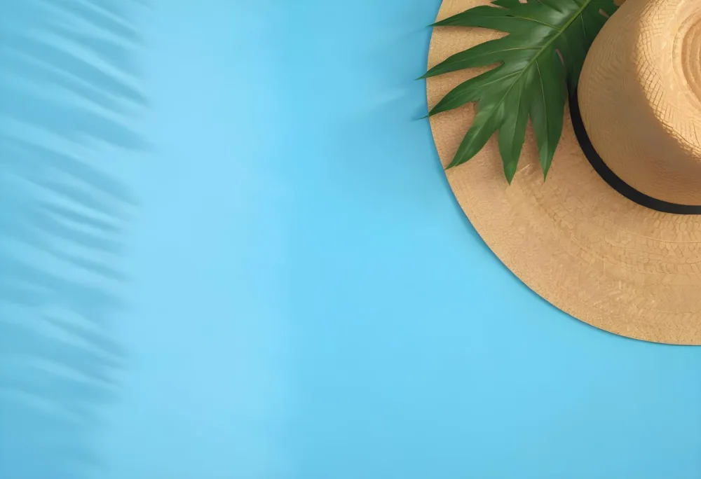 Straw Hat With A Green Palm Leaf On A Blue Wooden Table Summer Vacation Concept Tropical Vibes Vibrant Colors Top Down Perspective Bright Sunlight 25 B0d4