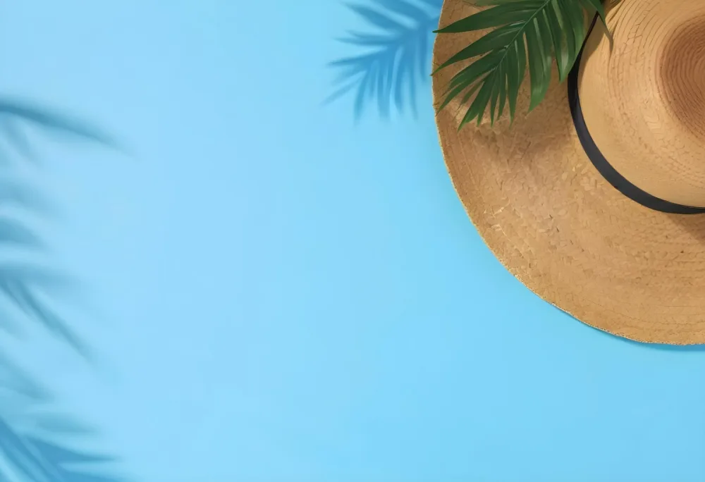 Straw Hat With A Green Palm Leaf On A Blue Wooden Table Summer Vacation Concept Tropical Vibes Vibrant Colors Top Down Perspective Bright Sunlight 28 16df