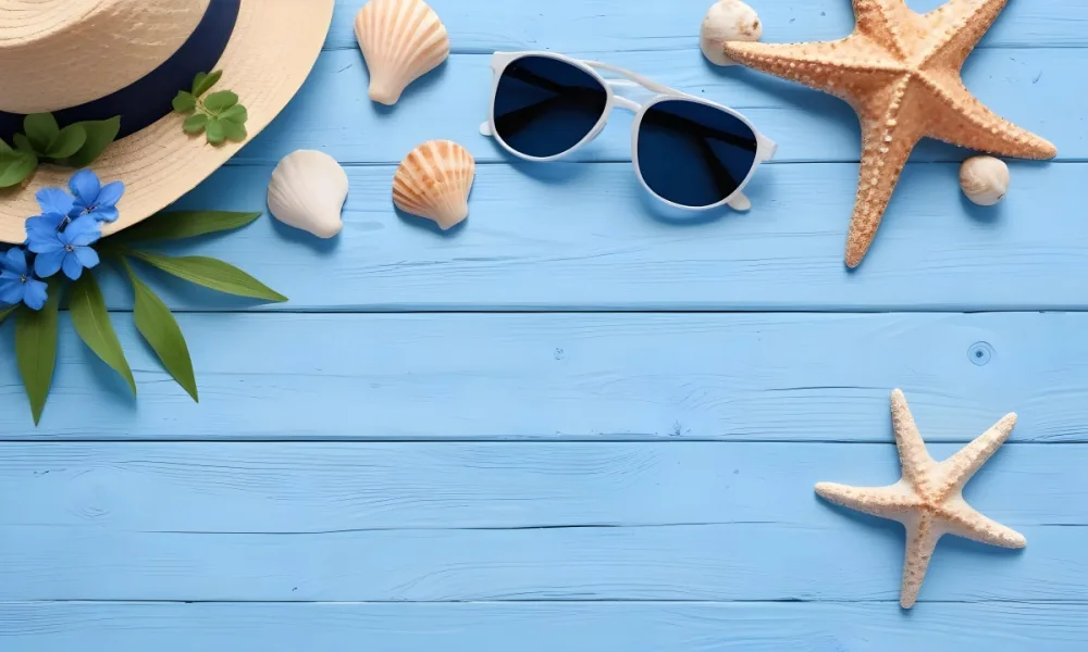 Sunglasses Seashells Starfish Hat And Blue Flowers On A Blue Wooden Table Summer Vacation Concept Tropical Background 11 1e3c