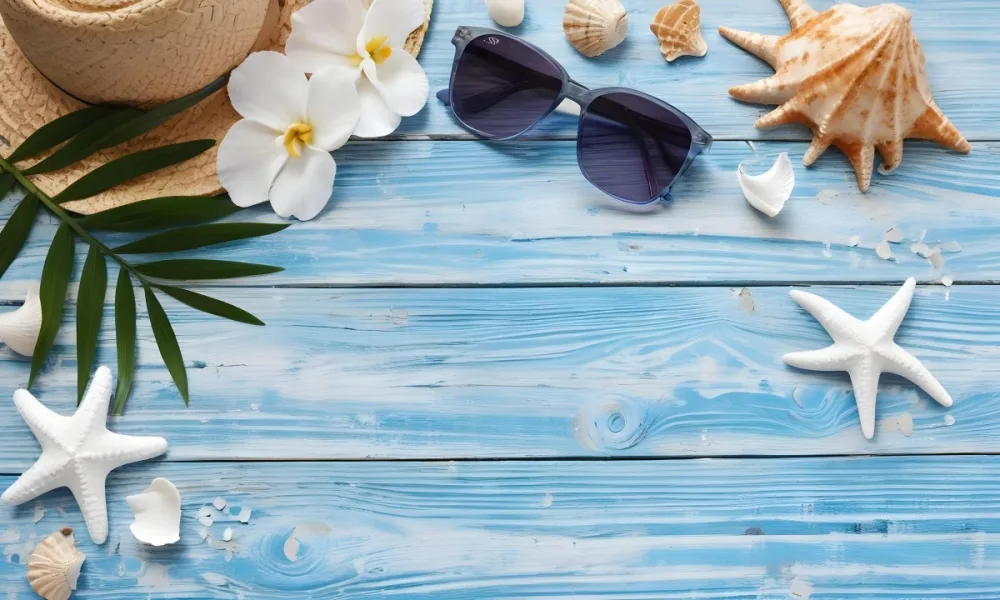 Sunglasses Seashells Starfish Hat And Blue Flowers On A Blue Wooden Table Summer Vacation Concept Tropical Background 3 1243