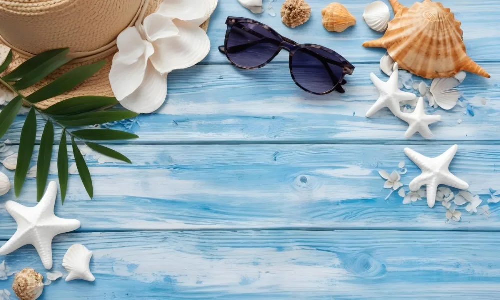Sunglasses Seashells Starfish Hat And Blue Flowers On A Blue Wooden Table Summer Vacation Concept Tropical Background 5 Ad2d