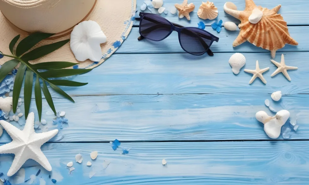 Sunglasses Seashells Starfish Hat And Blue Flowers On A Blue Wooden Table Summer Vacation Concept Tropical Background 7 Ba2e