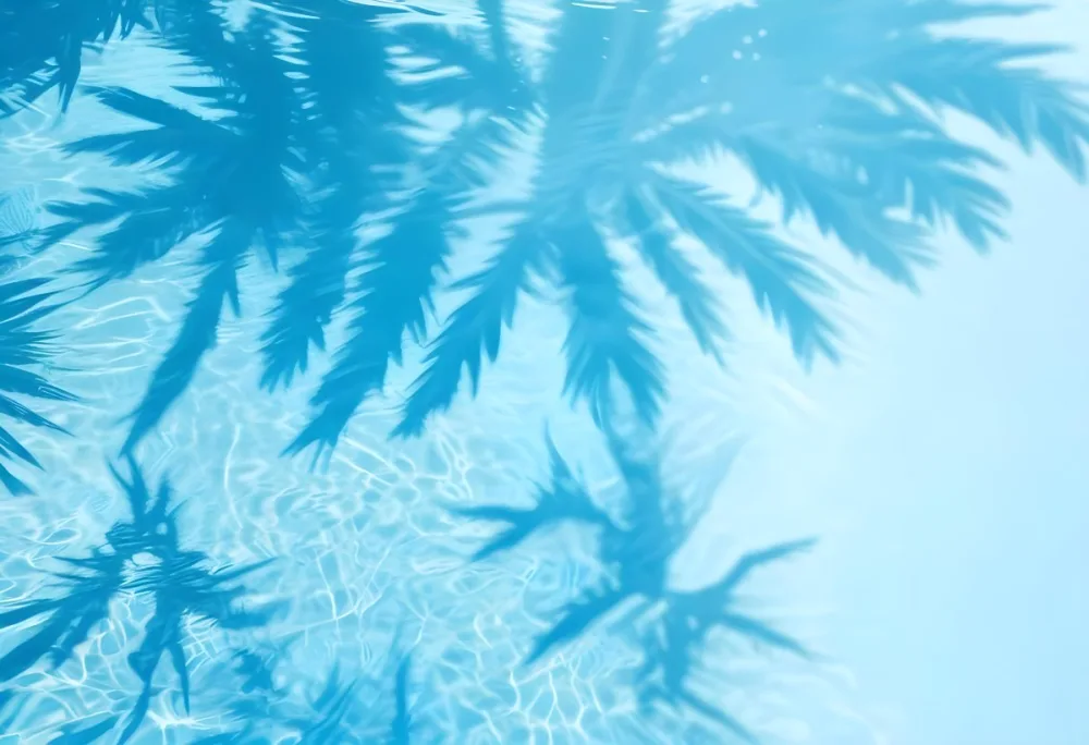 Water Surface With The Reflection Of A Palm Tree In A Bright Blue Color Creating A Refreshing And Tropical Atmosphere Perfect For Summer Themes 17 66c2