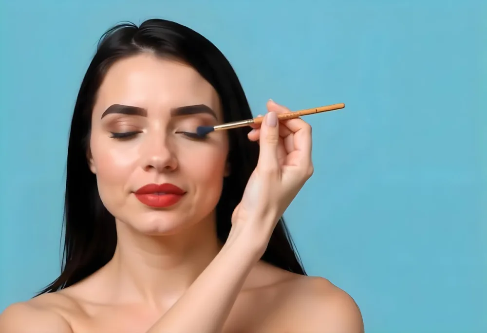 A 22 Year Old Hispanic Woman With Blue Hair Applying Makeup With A Brush Black Lipstick Closed Eyes In A Black Background 18 C15b