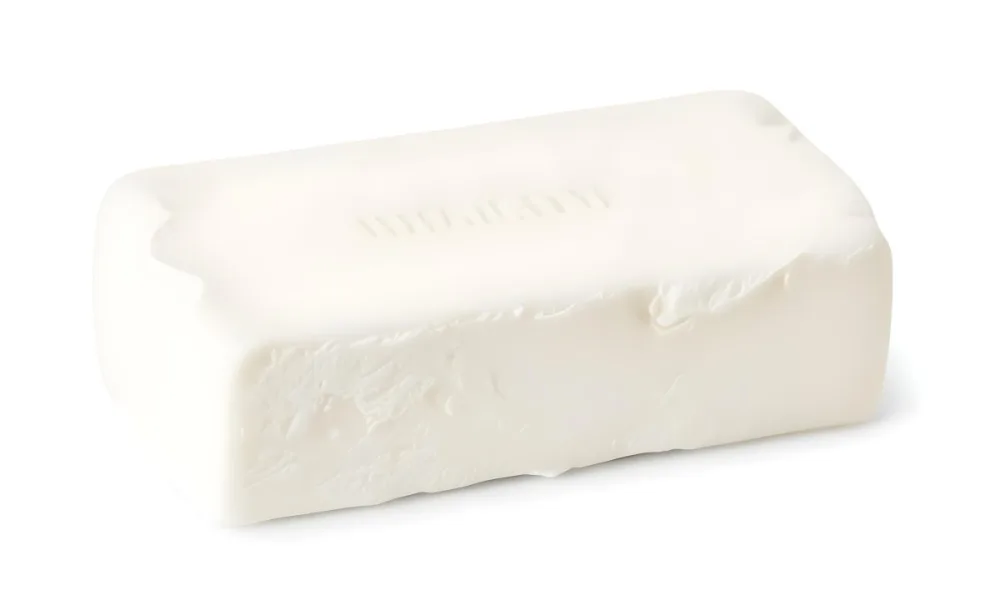 A Bar Of White Soap With A Slightly Rough Texture Casting A Soft Shadow On A Plain White Background 21 1228