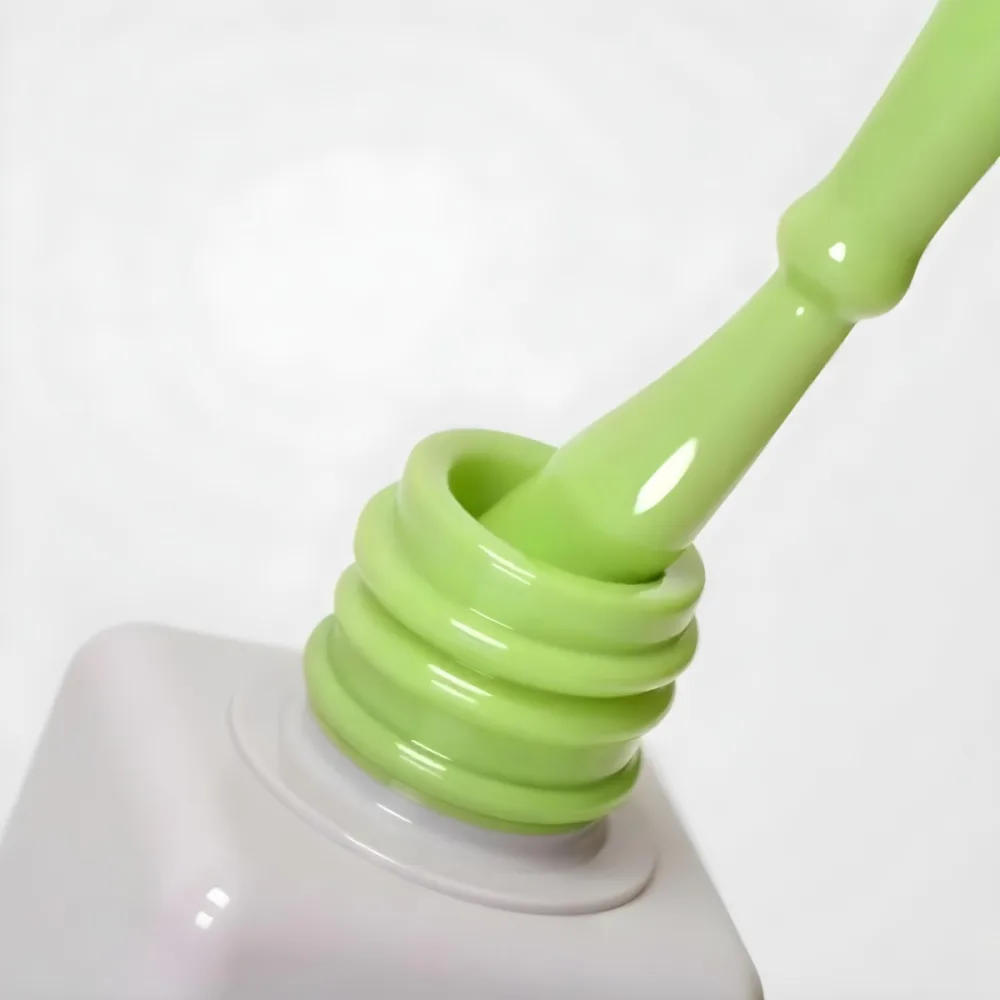 A Bottle Of Light Green Nail Polish With The Brush Inside The Bottle Is White Plain Background 20 4aa6