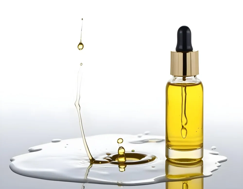 A Bottle Of Yellow Oil With A Dropper A Splash Of Oil On A White Surface And A White Background 6 Cd40