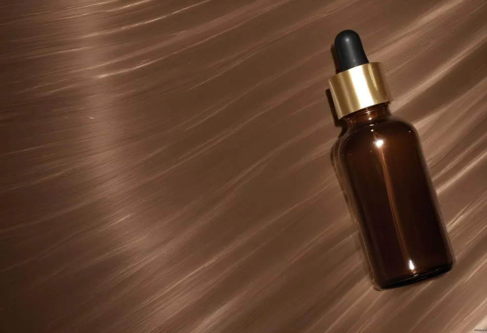 A Brown Glass Bottle With A Dropper On A Background Of Brown Hair The Hair Is Wavy And Shiny The Bottle Is In The Upper Right Corner 21 37de