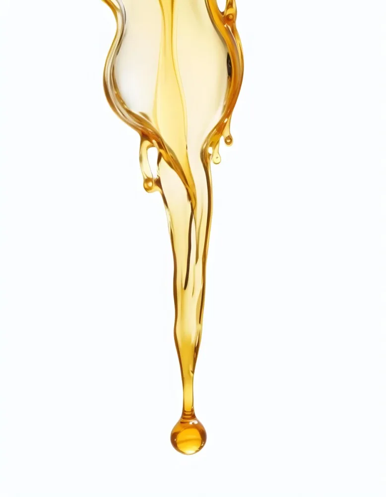 A Close Up Image Of A Glass Container Filled With A Golden Viscous Liquid Likely Cooking Oil The Liquid Appears To Be Dripping Out Of The Container Creating An Abstract And Visually Appealing Compositi 6 1802