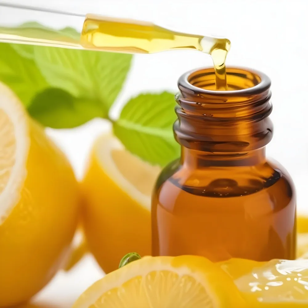 A Close Up Of An Amber Glass Bottle With A Dropper Positioned Among Fresh Lemons And Green Mint Leaves A Drop Of Green Liquid Is About To Fall From The Dropper Into The Bottle The Background Is Light And Bright Emph 5 Ed2b
