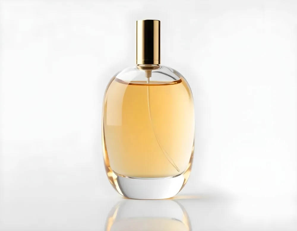 A Glass Bottle Of Amber Colored Perfume Or Cologne With A Gold Colored Cap 11