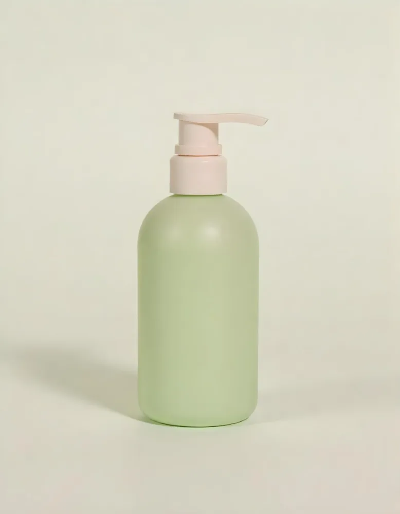 A Green Plastic Bottle With A Pump Dispenser Likely Containing A Liquid Soap Or Hand Sanitizer Product Green Plastic Bottle With A Pump Dispenser Likely Containing Liquid Soap Product Placed On A Bathroo 12 1bbe