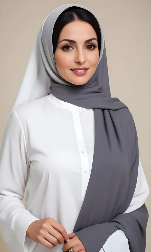 A Middle Aged Middle Eastern Woman With Dark Hair Wearing A White Blouse And A Gray Hijab 2 E888