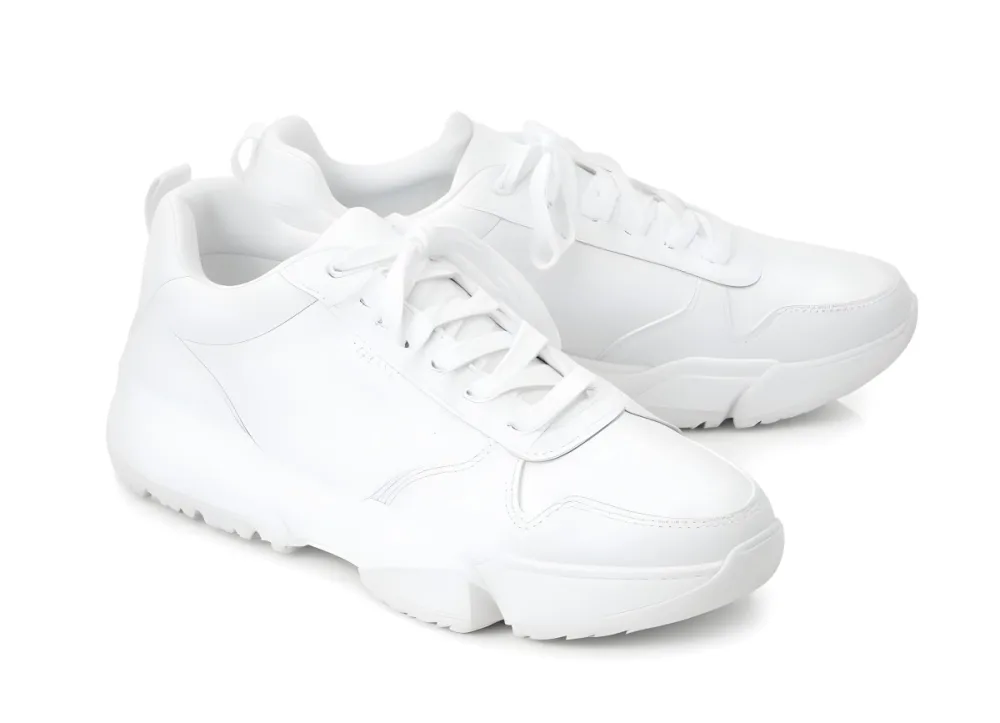 A Pair Of White Sneakers With White Laces White Sole White Background 33 9888