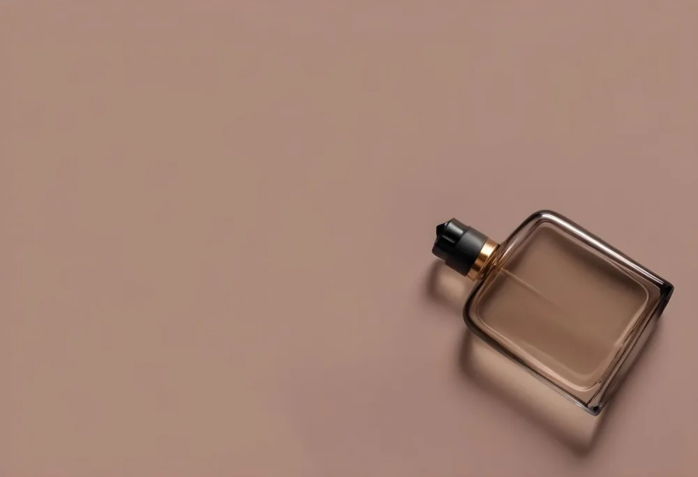 A Perfume Bottle With A Black Spray Nozzle On A Plain Black Background The Bottle Is Clear And Partially Filled With Liquid 28 879a
