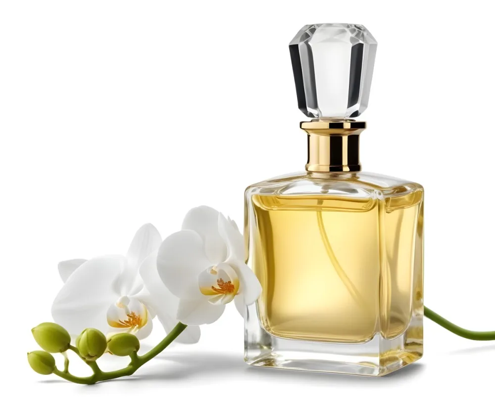 A Perfume Bottle With A Golden Cap Filled With Golden Liquid Next To A White Orchid On A White Background 16 5830
