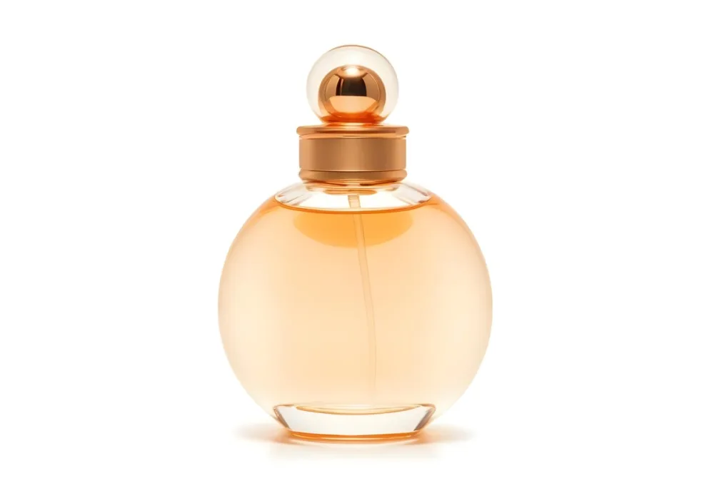 A Perfume Bottle With A Round Body And A Spherical Cap Filled With A Light Orange Liquid On A White Background 4 A863