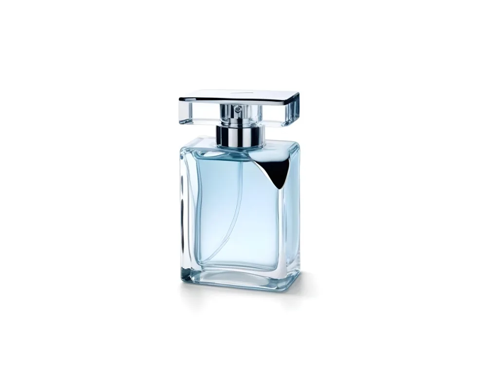 A Perfume Bottle With A Silver Cap And A Transparent Nozzle The Bottle Is Filled With A Light Blue Liquid White Background 38 0a62