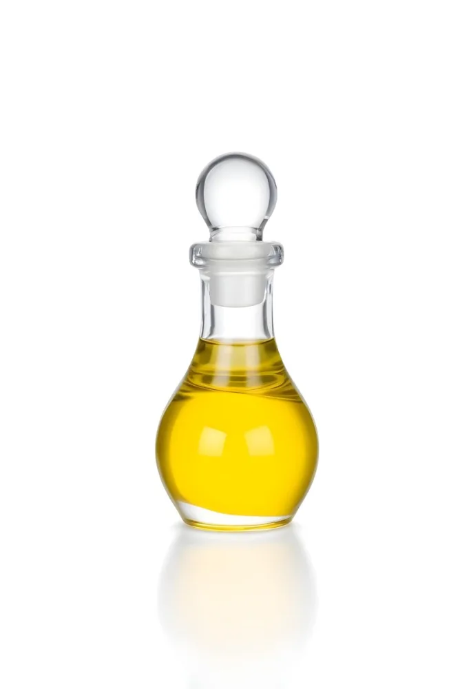 A Small Glass Bottle With A Round Stopper Filled With Yellow Liquid On A White Background 19 5d32