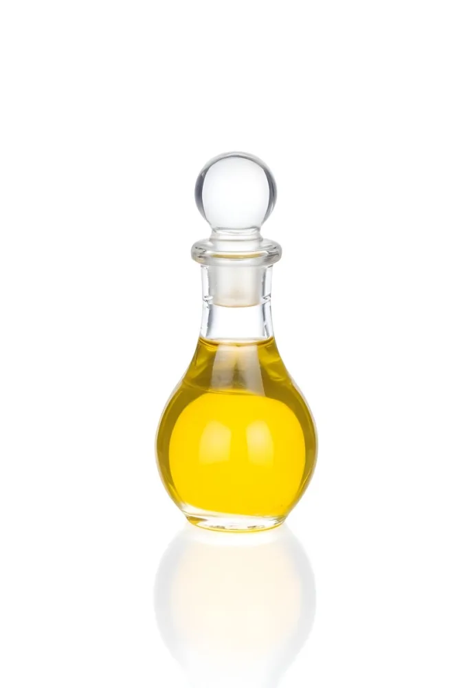 A Small Glass Bottle With A Round Stopper Filled With Yellow Liquid On A White Background 24 5383