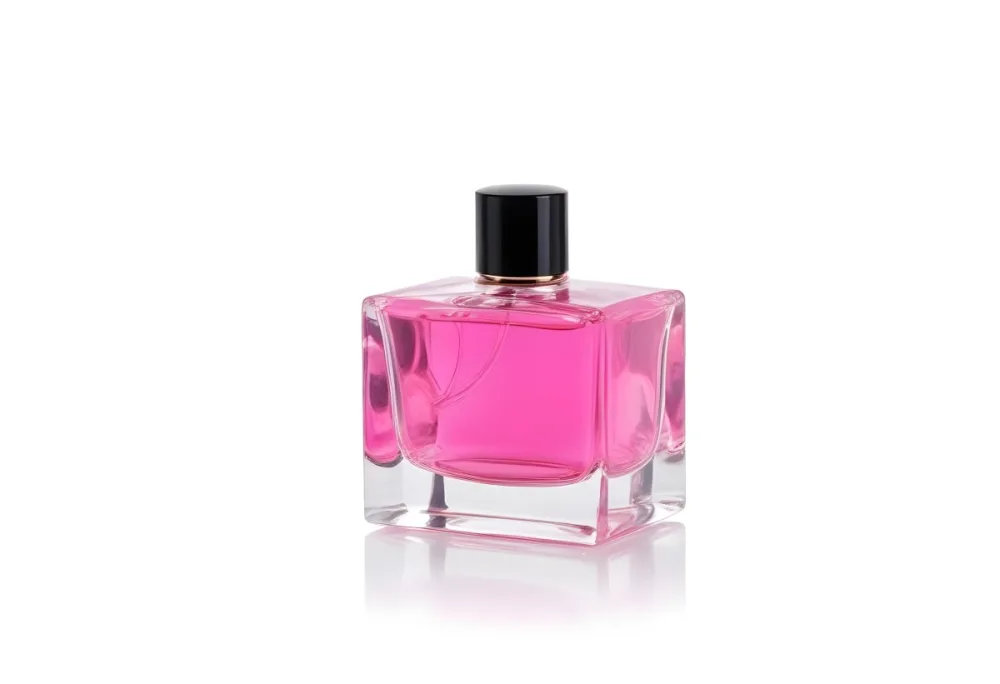A Square Glass Perfume Bottle With A Pink Cap Filled With Bright Pink Liquid On A Black Background 41 7321