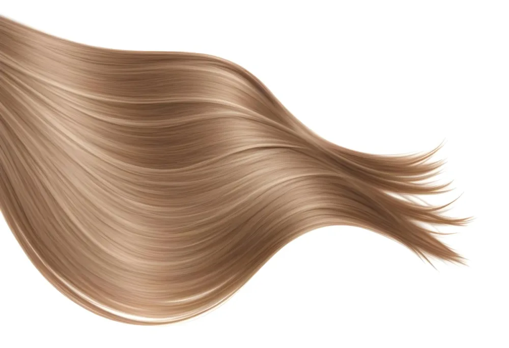 A Strand Of Long Wavy Light Brown Hair With Subtle Highlights Flowing And Curving Against A Plain White Background Showcasing Its Texture And Color 31 E179
