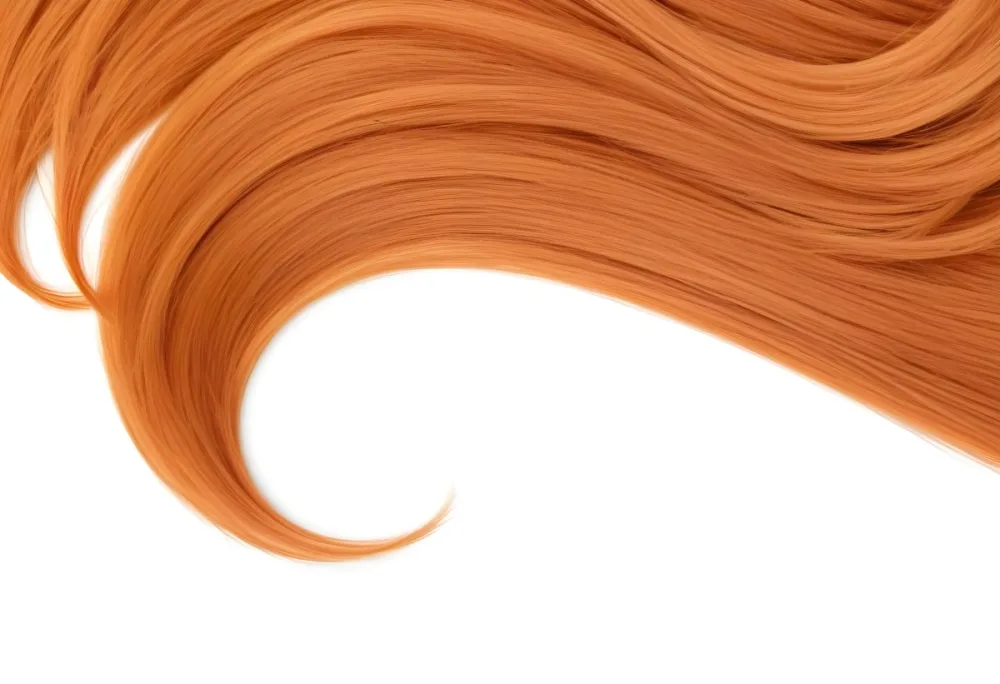 A Strand Of Vibrant Ginger Hair With A Pronounced Curl Against A Stark White Background Showcasing Its Texture And Color 12