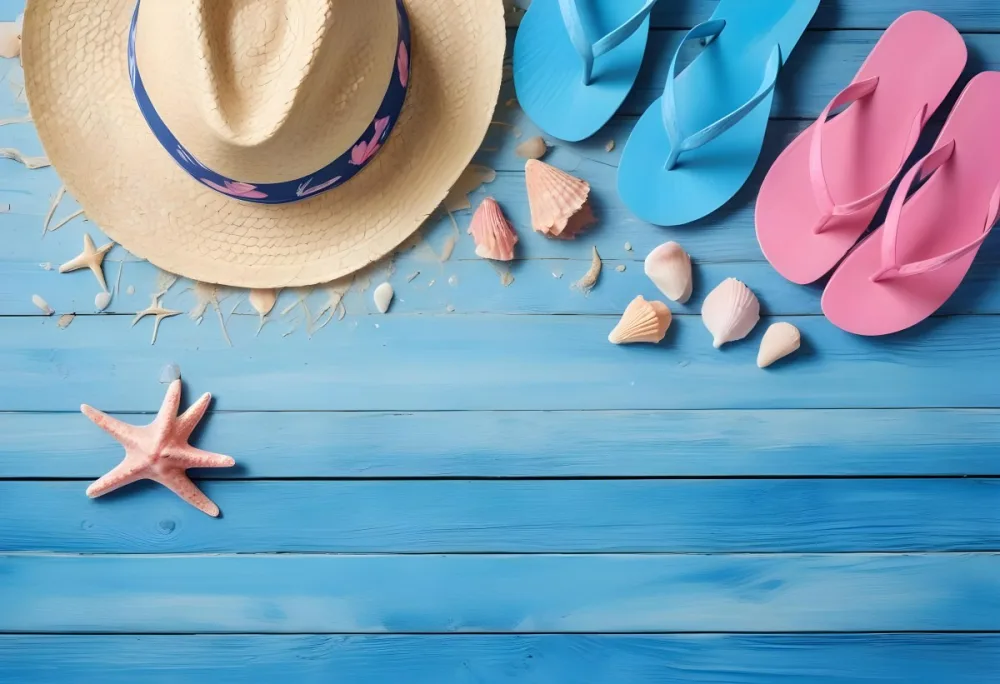 A Straw Hat Blue And Pink Flip Flops And Seashells Scattered On A Blue Wooden Surface Evoking A Beach Vacation Atmosphere 12 66ac