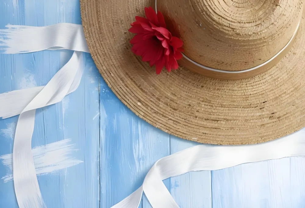 A Straw Hat With A White Ribbon On A Blue And White Wooden Surface The Hat Is Partially Visible The Background Is Textured 11