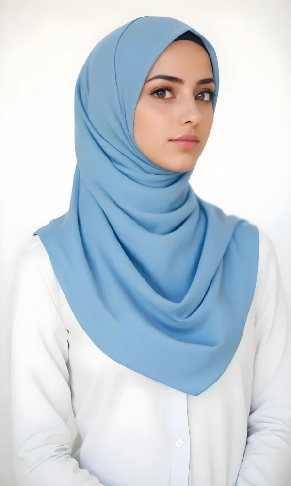 A Young Middle Eastern Woman Wearing A Light Blue Hijab Looking Directly At The Camera With A Serious Expression 15 B639