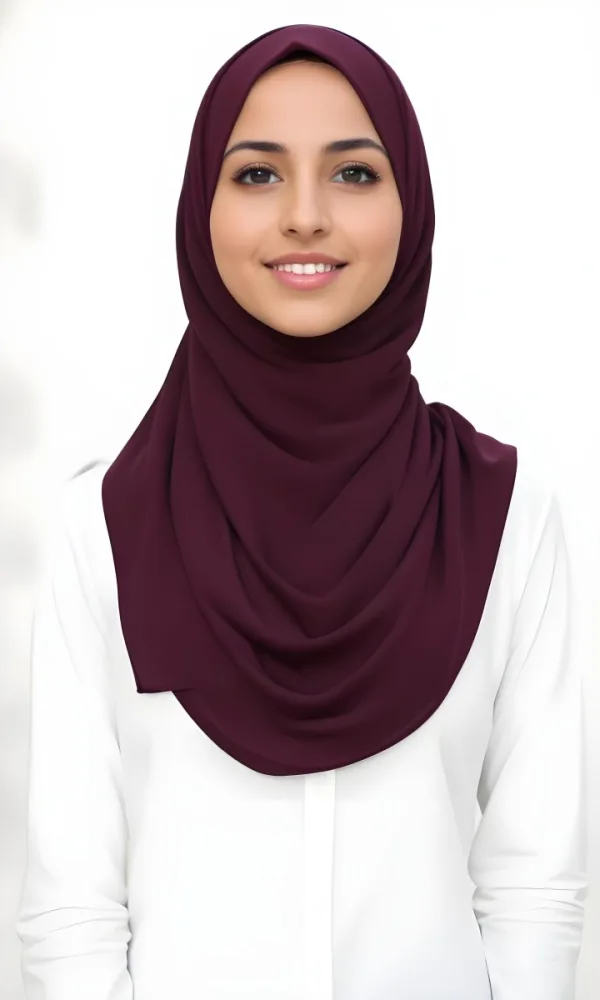 A Young Middle Eastern Woman With Dark Hair Wearing A Burgundy Hijab Smiling At The Camera 14 2fac