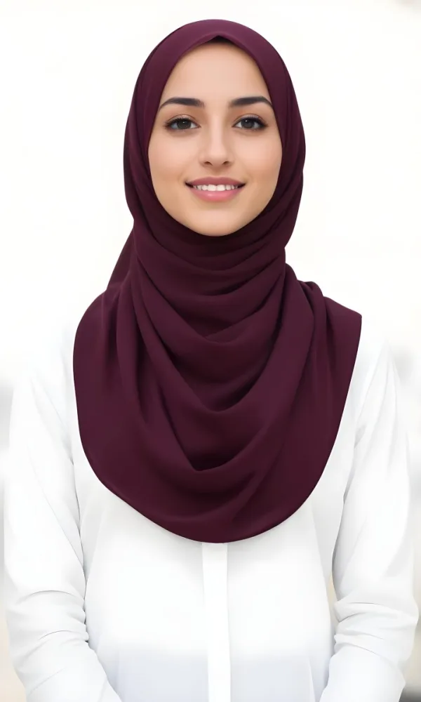 A Young Middle Eastern Woman With Dark Hair Wearing A Burgundy Hijab Smiling At The Camera 16 D602
