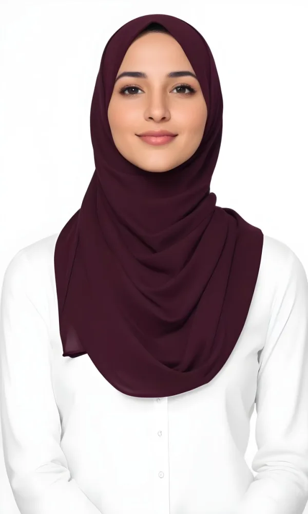 A Young Middle Eastern Woman With Dark Hair Wearing A Burgundy Hijab Smiling At The Camera 22 7797