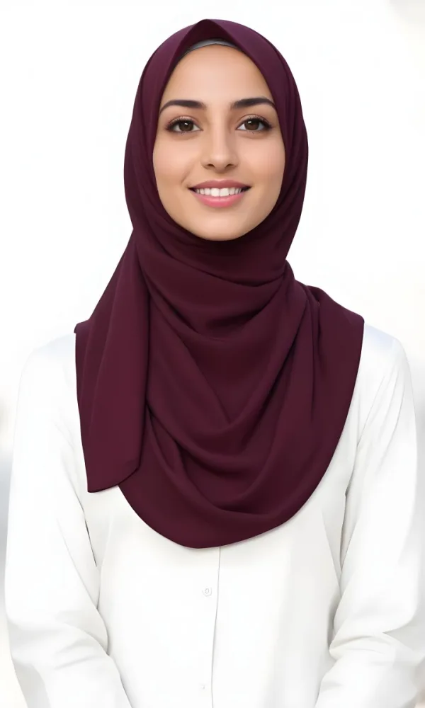 A Young Middle Eastern Woman With Dark Hair Wearing A Burgundy Hijab Smiling At The Camera 9 8e1f