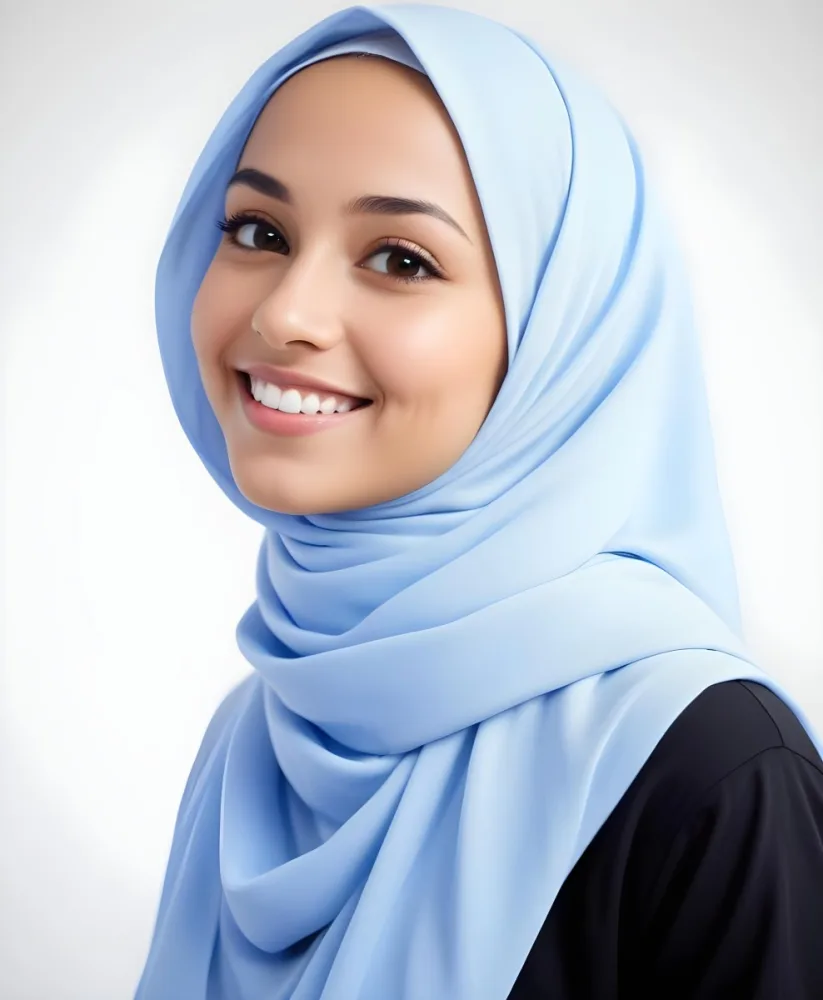 A Young Middle Eastern Woman With Dark Hair Wearing A Light Blue Hijab Smiling At The Camera 19 E61d