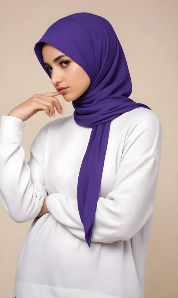 A Young Middle Eastern Woman With Dark Hair Wearing A Purple Hijab Looking Directly At The Camera With A Serious Expression 6 A16b