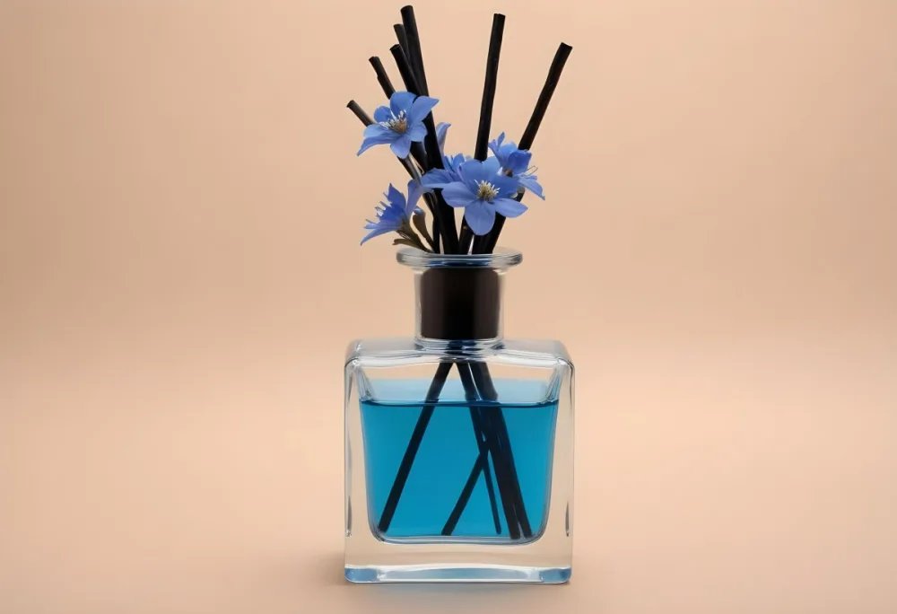 Aromatic Essence In A Glass Container With Black Sticks And Blue Flowers On A Beige Background 10 4d14