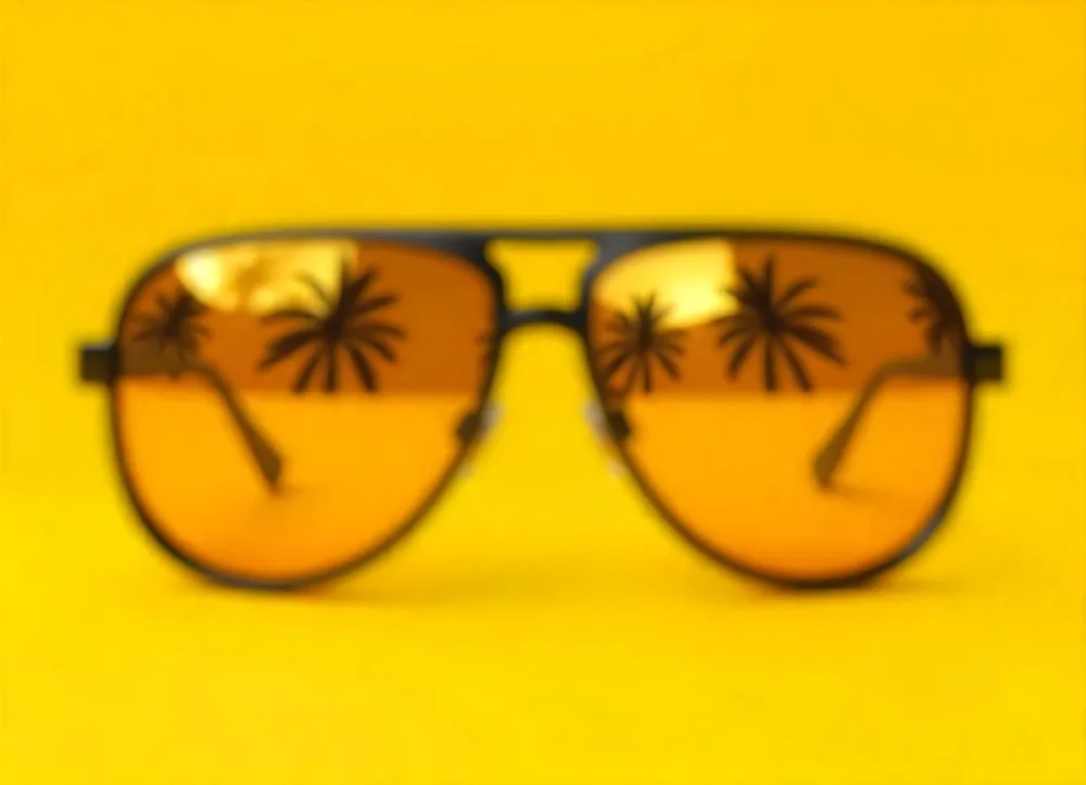 Aviator Sunglasses With Black Frame And Yellow Lenses Reflecting Palm Trees On A Yellow Background 4 C677